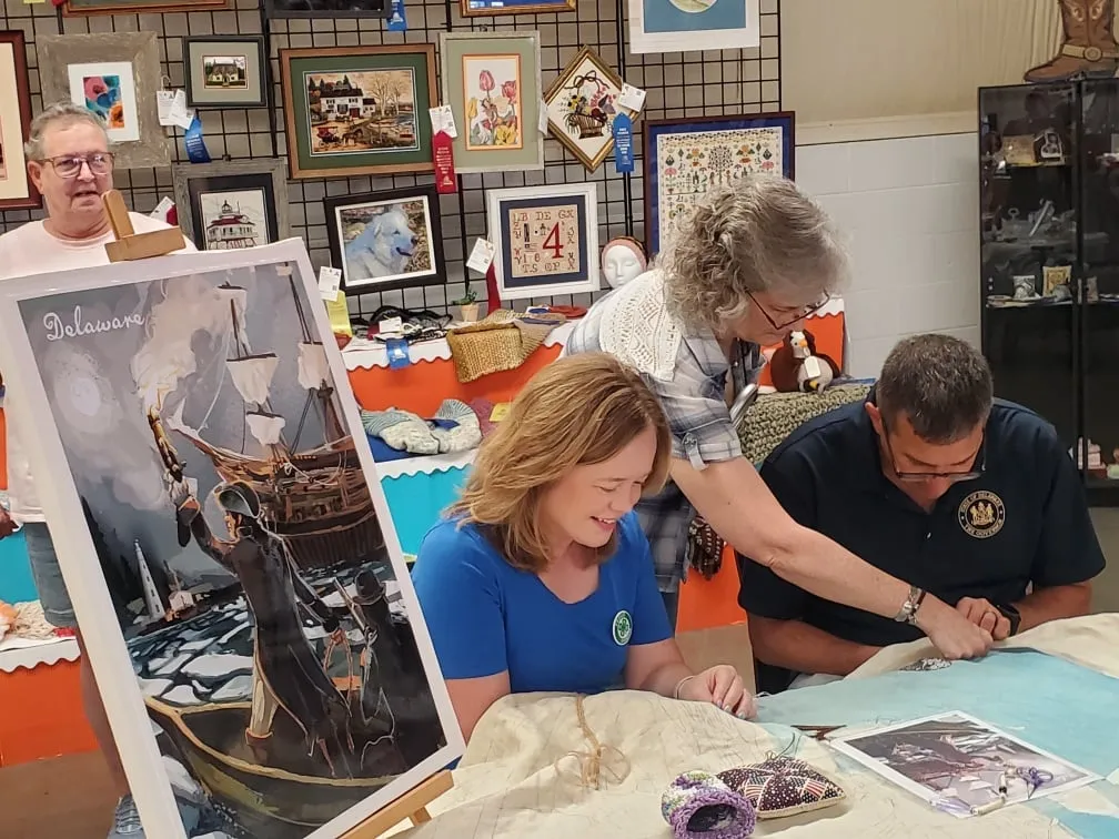 The Governor takes a stitch or two