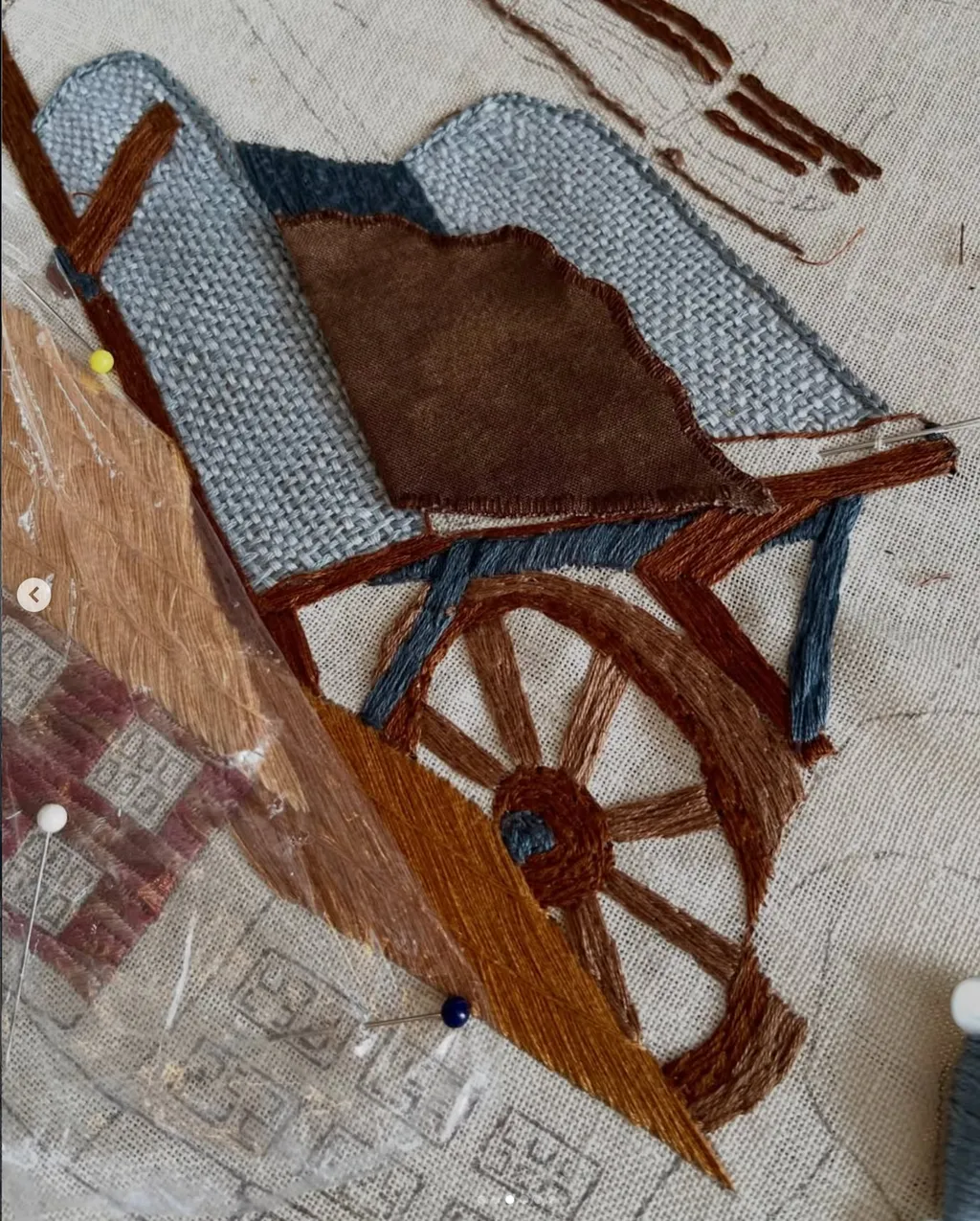 A detail of a wagon on the New York panel