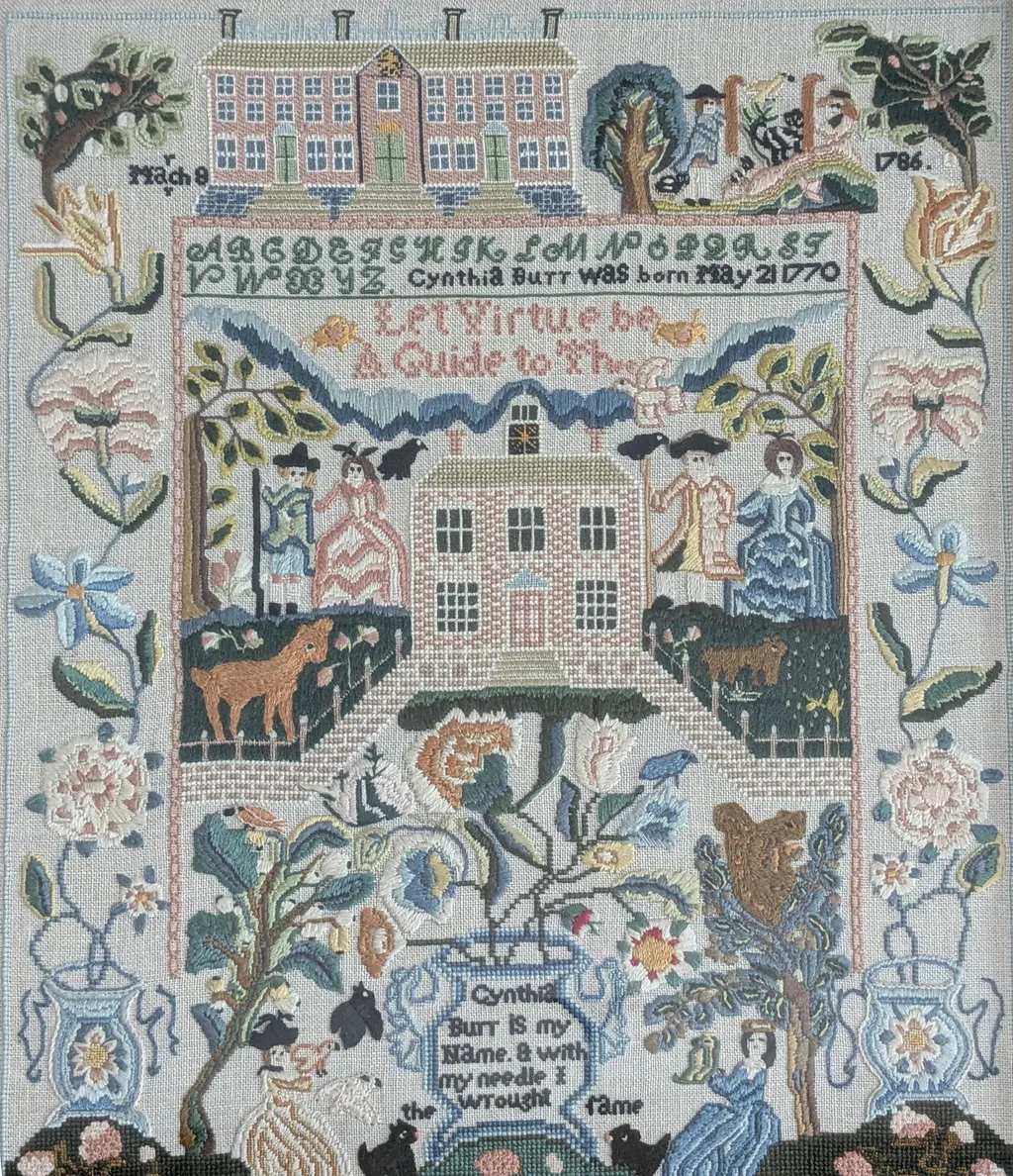 An embroidered sampler by Janis