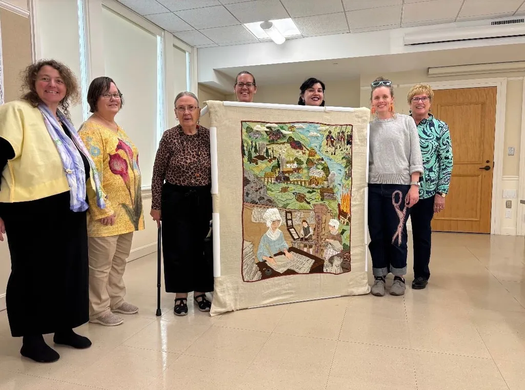 Connecticut volunteers gather to celebrate the finished panel