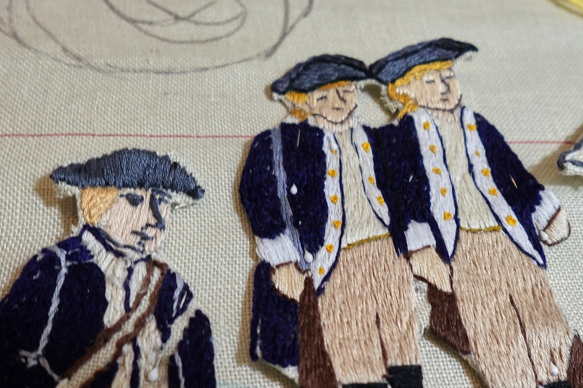 Volunteer hand-stitching an America's Tapestry embroidered panel